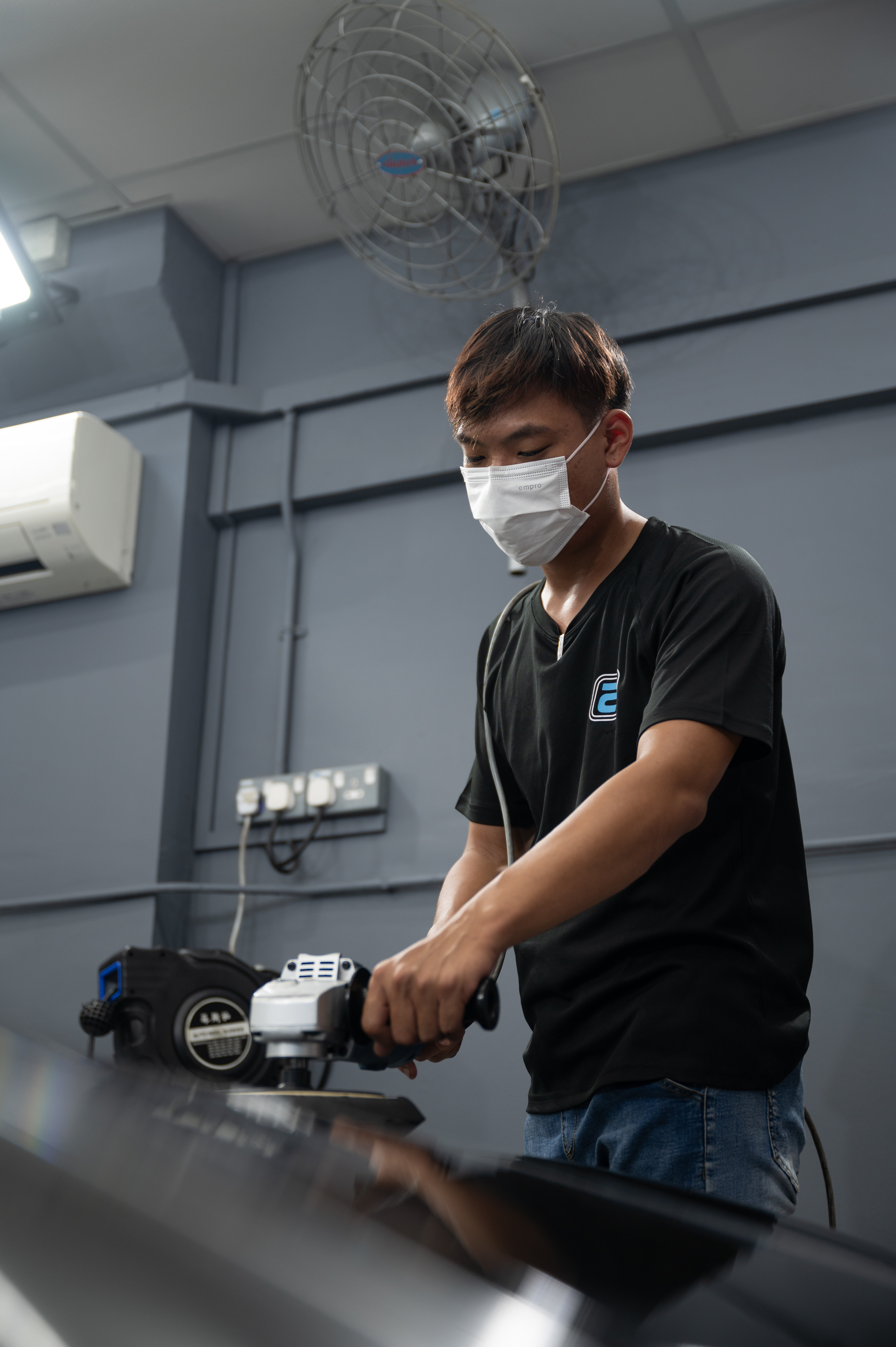 Detailer cleaning the interior of a vehicle